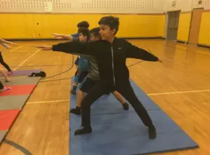 Monroe fifth graders lead classmates in yoga and mindfulness